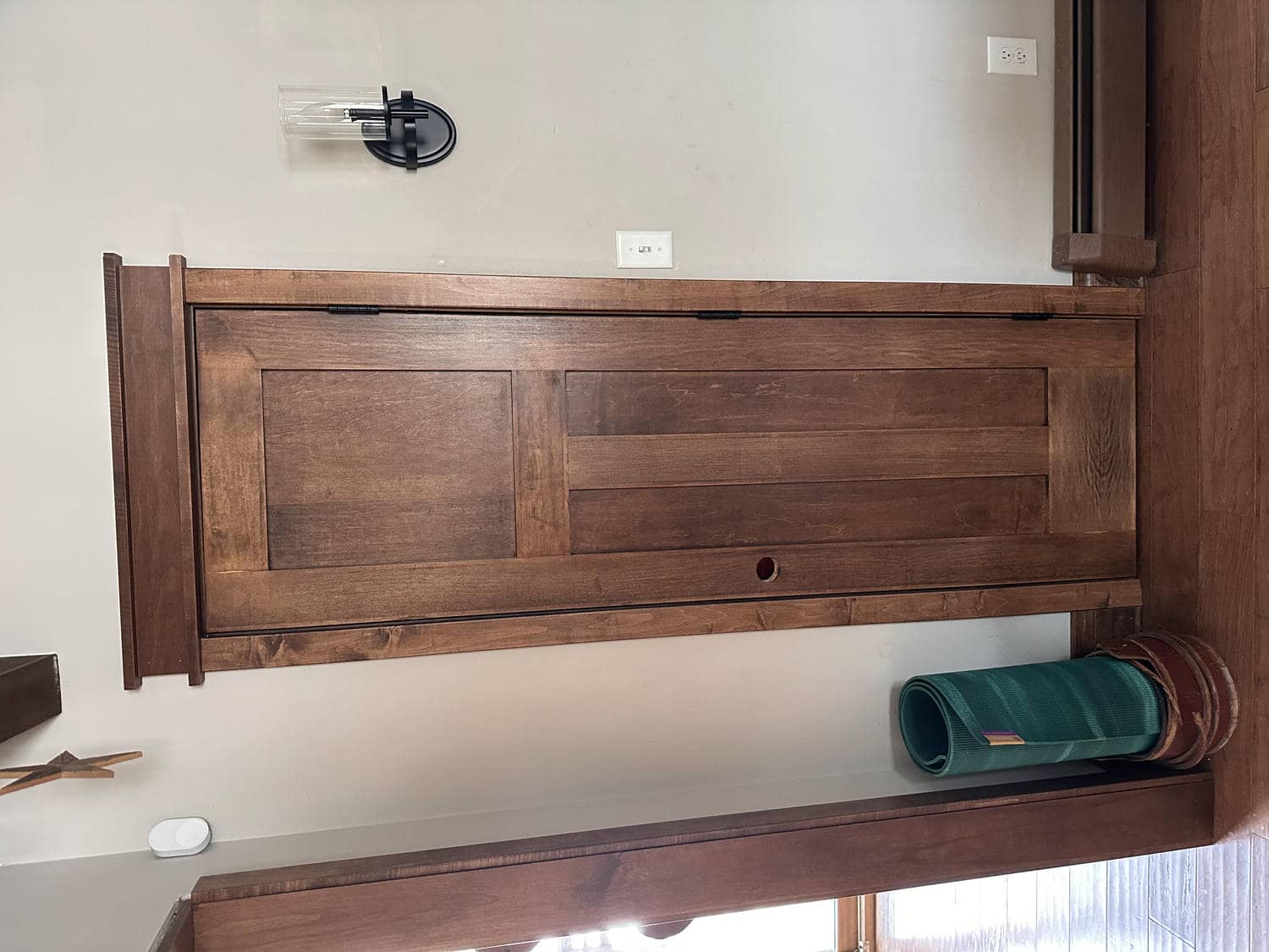 Craftsman-style stained wood door with matching casing by Bond Trim LLC