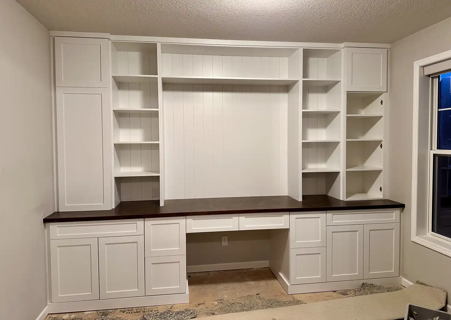 White shaker built-in cabinetry and desk wall by Bond Trim LLC